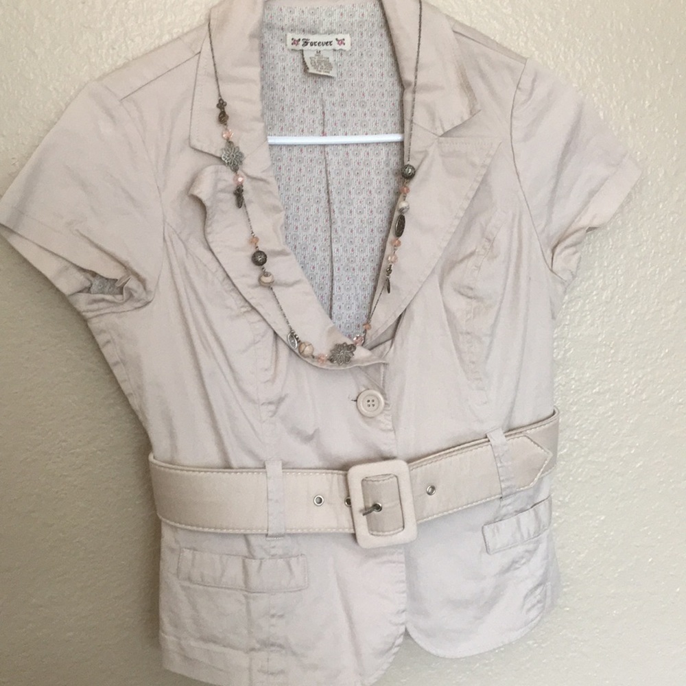 Cream colored short sleeve button up cover jacket